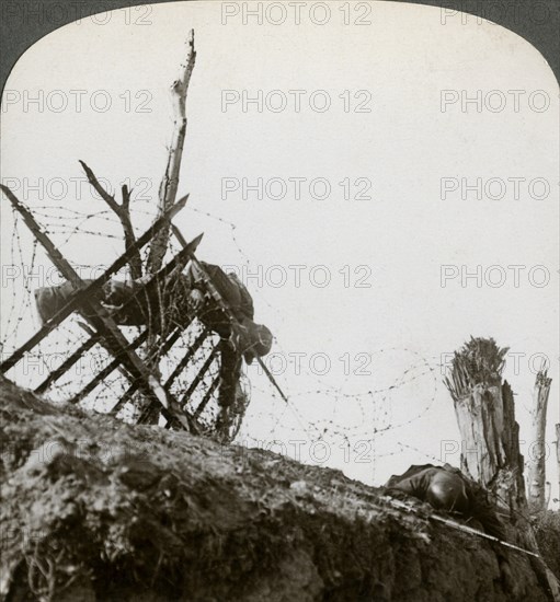 Dead German soldiers on the wire after a night raid, Givenchy, France, World War I, 1914-1918.Artist: Realistic Travels Publishers