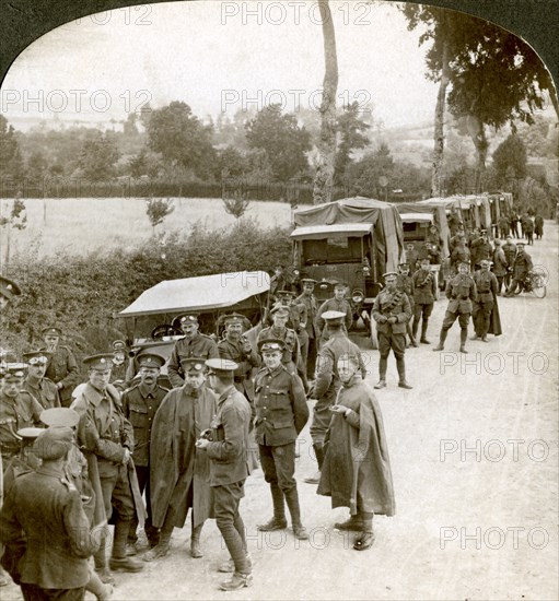 Ammunition convoy parked in a Flanders lane awaiting orders, World War I, 1914-1918.Artist: Realistic Travels Publishers