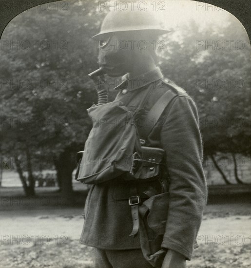 Infantry fitted with the latest gas marks and steel helmets, World War I, 1915-1918.Artist: Realistic Travels Publishers