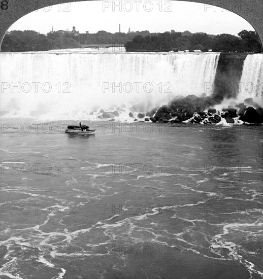 Niagara Falls and the 'Maid of the Mist', from the Canadian Cliffs, Canada.Artist: Realistic Travels Publishers