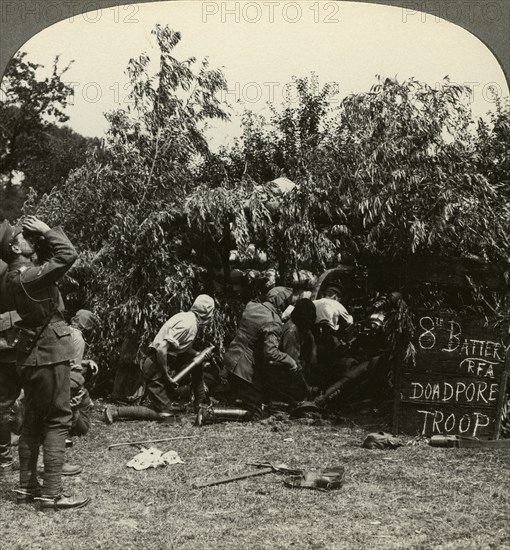 Gunners wearing gas masks, World War I, 1914-1918.Artist: Realistic Travels Publishers