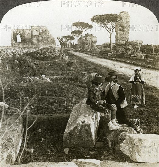 Tombs and children in traditional dress, Appian Way, Rome, Italy.Artist: Underwood & Underwood
