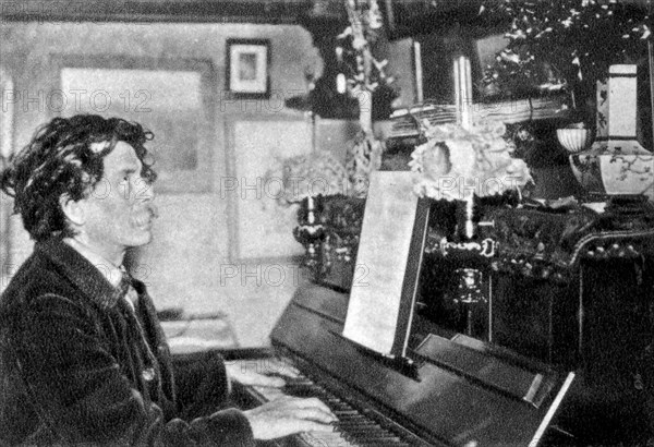 Maurice Rollinat, French poet, playing the piano, 1902. Artist: Unknown