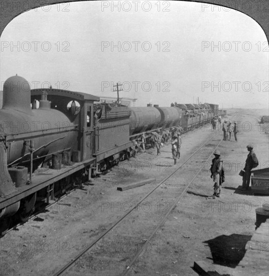 Trainload of armoured cars, South West Africa, World War I, 1914-1918.Artist: Realistic Travels Publishers