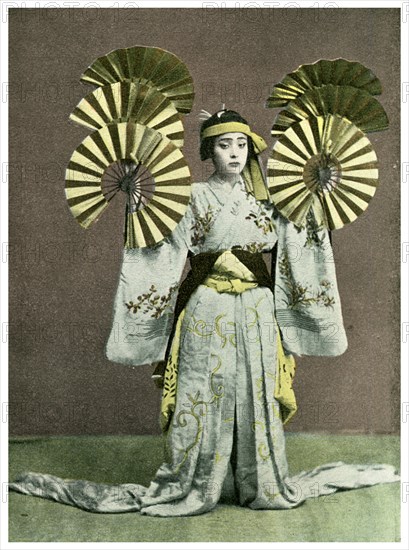 Girl performing a fan dance, Japan, 1904. Artist: Unknown