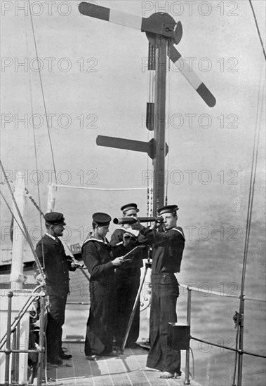 Signalling by semaphore on board HMS 'Camperdown', 1895. Artist: Gregory & Co