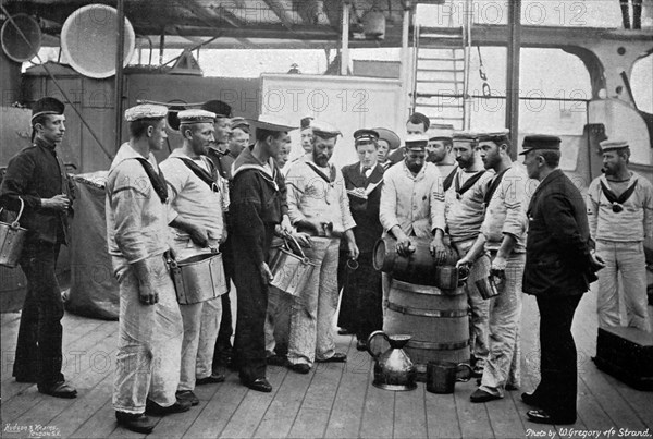 Issuing rum on board HMS 'Royal Sovereign', 1896. Artist: W Gregory