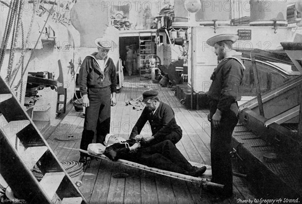 Ambulance drill on board the cruiser HMS 'Tartar', 1896.Artist: W Gregory