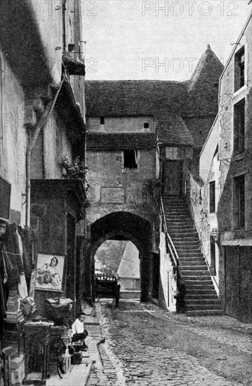 An old curiosity shop in Falaise, Normandy, France, c1930s. Artist: Humphrey Joel