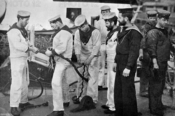 Blue jackets at work splicing a rope on board the battleship HMS 'Majestic', 1896.Artist: Gregory & Co