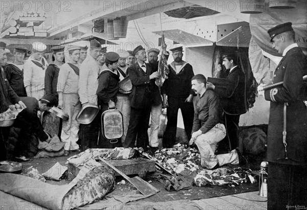 Serving out a day's fresh meat ration on board HMS 'Talbot', 1896. Artist: WM Crockett