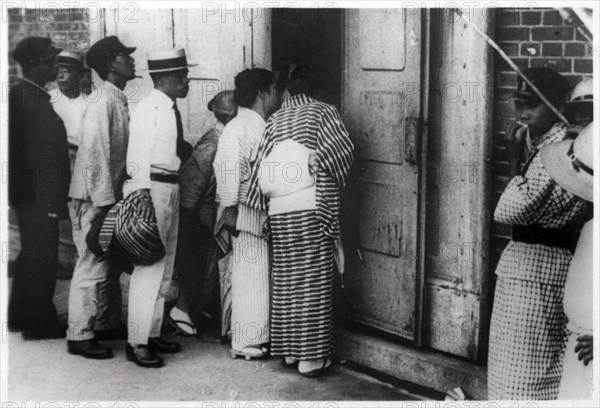 Japanese crowd looking into the Zeppelin hangar, Kasumigaura, Japan, 1929 (1933). Artist: Unknown