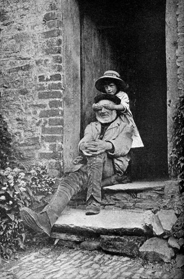 A child with her grandfather, England, c1922.Artist: AW Cutler