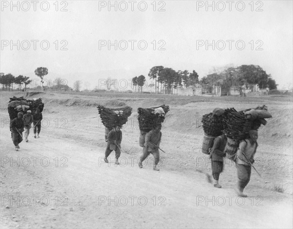 Charcoal bearers on the road to Peking, China, late 19th or early 20th century. Artist: Unknown