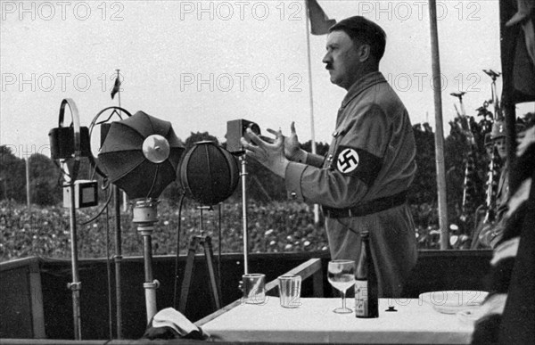 Adolf Hitler addressing the German people at the Nuremberg Rally, Germany, 1935. Artist: Unknown