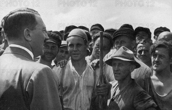 'A statesman moves among the workers', Germany, 1936. Artist: Unknown