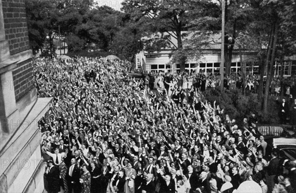 A crowd gathered beneath Adolf Hitler's window, Bayreuth, Germany, 1936. Artist: Unknown