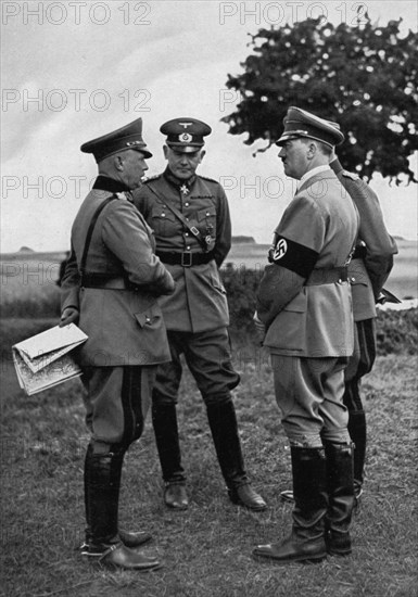 Adolf Hitler with senior German army officers, Munster training area, Germany, 1935. Artist: Unknown