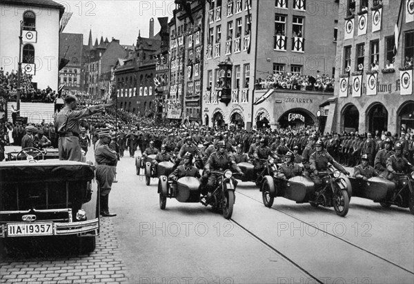 Adolf Hitler reviewing motorcycle troops at the Nuremberg Rally, Germany, 1935. Artist: Unknown