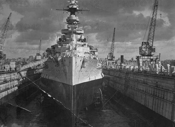 British battleship HMS 'Malaya' in a floating dock, Malta, c1937. Artist: Unknown