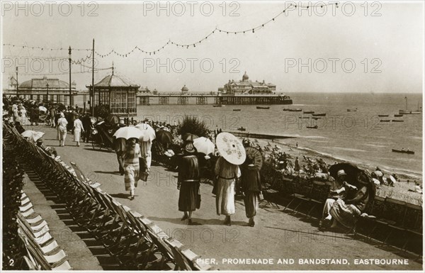 Pier, promenade and bandstand, Eastbourne, Sussex, c1920s(?). Artist: Unknown