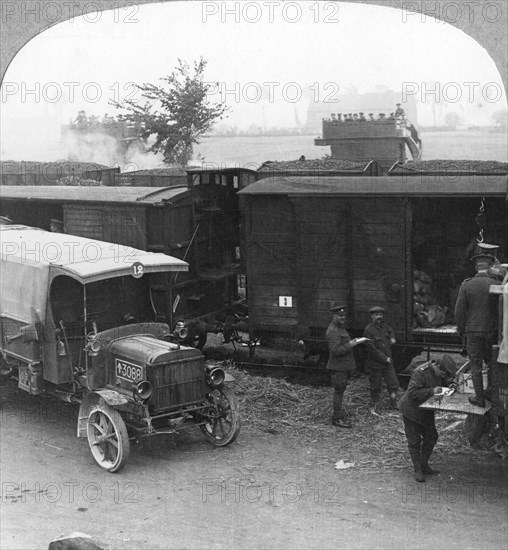 Troops and supplies are rushed from a railhead to the firing line, World War I, c1914-c1918. Artist: Realistic Travels Publishers