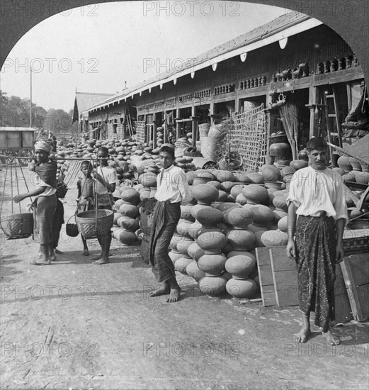 Pottery shop on a street in Mandalay, Burma, 1908.  Artist: Stereo Travel Co