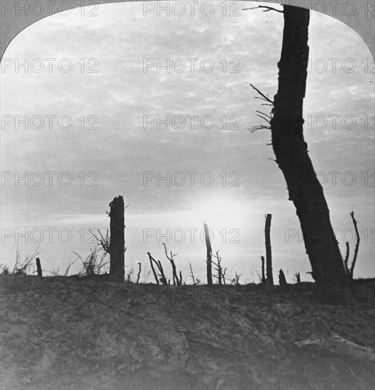 The Sun going down over 'no man's land' on the Somme, France, World War I, c1914-c1918. Artist: Realistic Travels Publishers