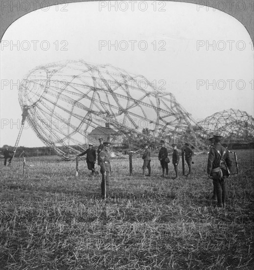 Zeppelin shot down near Colchester, Essex, World War I, 1916. Artist: Realistic Travels Publishers