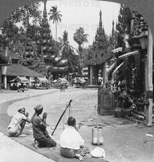 Worshipping before an idol, Shwedagon Pagoda, Rangoon, Burma, 1908. Artist: Stereo Travel Co