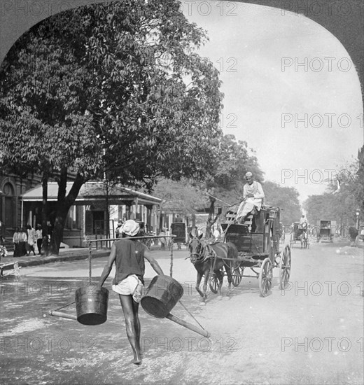 Watering the streets of Rangoon, Burma, 1908. Artist: Stereo Travel Co