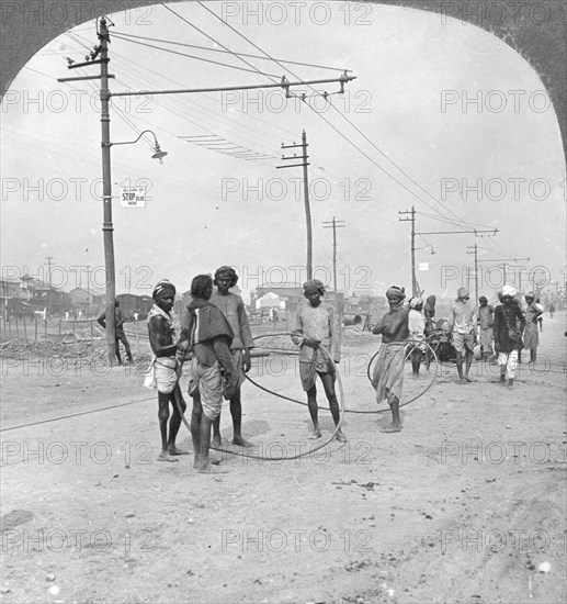 Men about to draw a heavy load, Rangoon, Burma, 1908. Artist: Stereo Travel Co