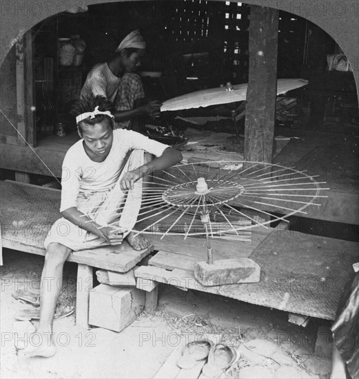 Boys making the native umbrella, Burma, 1908. Artist: Stereo Travel Co