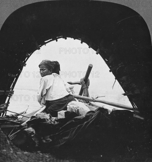 A boatman on the Irrawaddy River, Burma, 1908. Artist: Stereo Travel Co