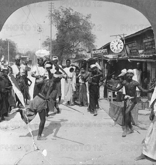 Young men performing a sword dance, Burma, 1908. Artist: Stereo Travel Co