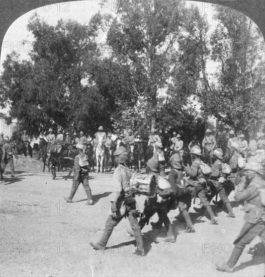 British commanders reviewing troops entering Kroonstadt, South Africa, Boer War, 1901. Artist: Underwood & Underwood