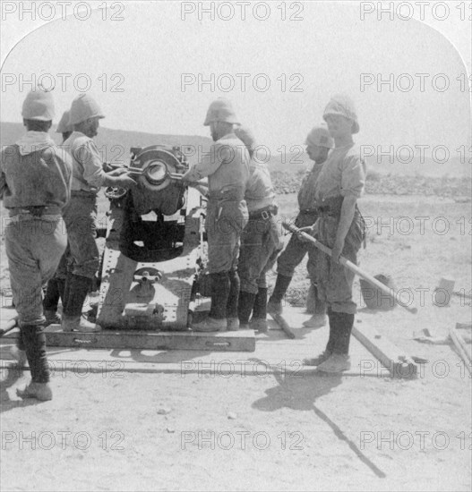 Putting a shell into a siege train gun at the Modder River, South Africa, Boer War, 1900. Artist: Underwood & Underwood