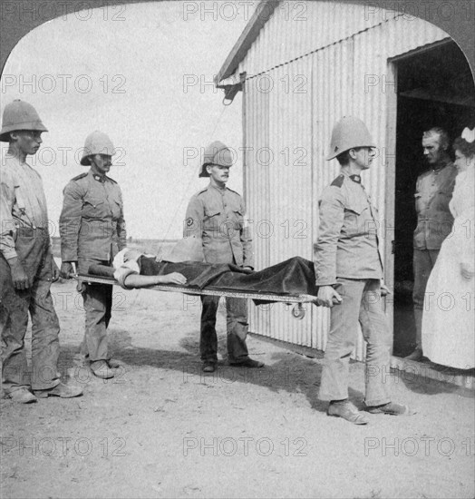 'Wounded fusilier after the Boers' brave stand near Orange River', South Africa, Boer War, 1900. Artist: Underwood & Underwood