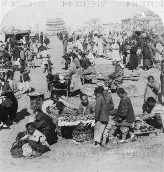 'A market in the Tartar (northern) city, looking toward Drum Tower', Peking (Beijing), China, 1901. Artist: Underwood & Underwood