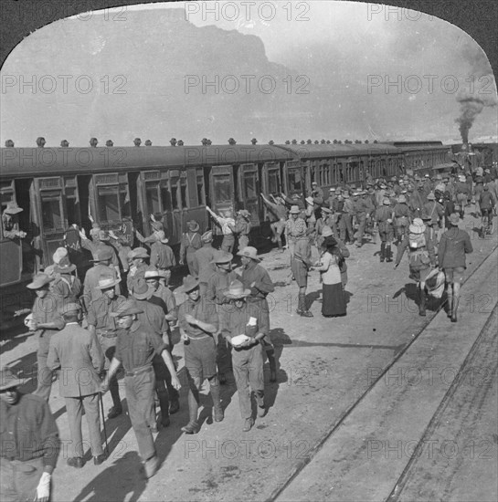 Soldiers of the Wiltshire Rifles boarding a train, Cape Town, South Africa, World War I, c1915. Artist: Realistic Travels Publishers