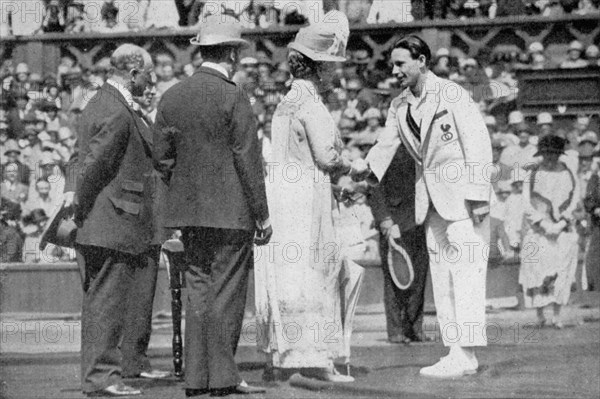 Jean Borotra receives his medal from Queen Mary on centre court, 1926. Artist: London News Agency