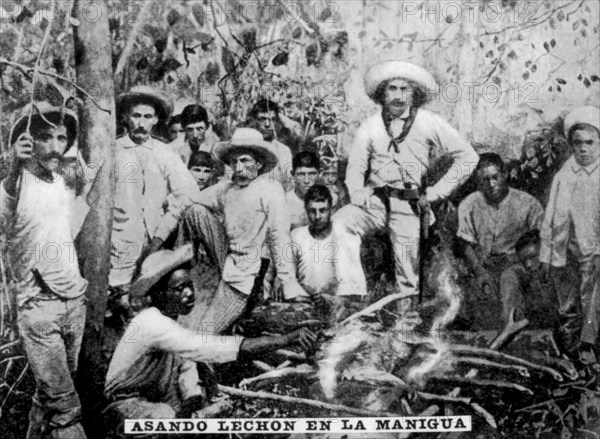 Roasting pig in the jungle, Cuba, (c1910). Artist: Unknown