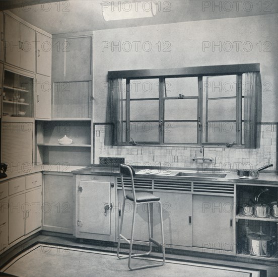 Section of a small kitchen, designed by Mrs Darcy Braddell, 1935. Artist: Unknown.