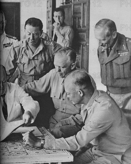 'Council of War in Algiers: Mr Churchill with his Captains', 1943. Artist: Unknown.