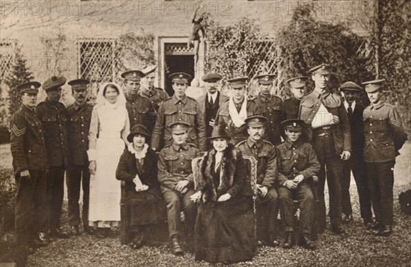 'Lady Elizabeth with Countess of Strathmore and convalescent wounded soldiers', 1916 Artist: Unknown.