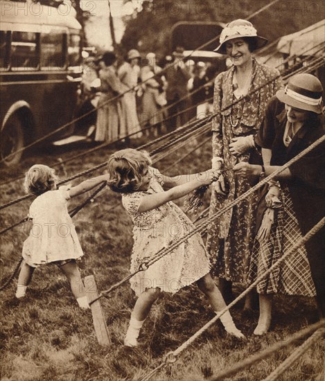 Princess Elizabeth and Princess Margaret pull their weight, 1930s (1935). Artist: Unknown.