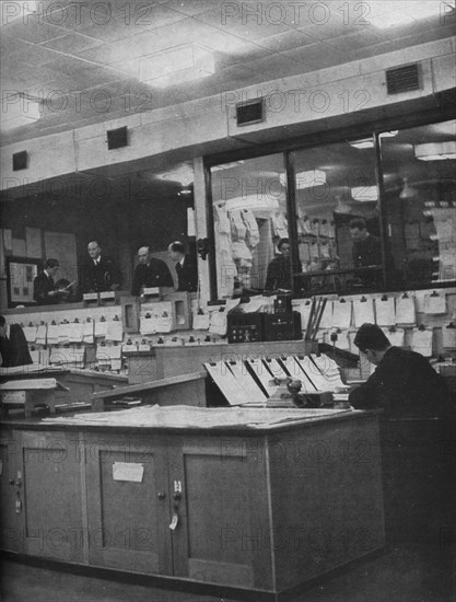 British Naval and Air Force officers working at Area Combined Headquarters, c1940 (1943). Artist: Unknown.