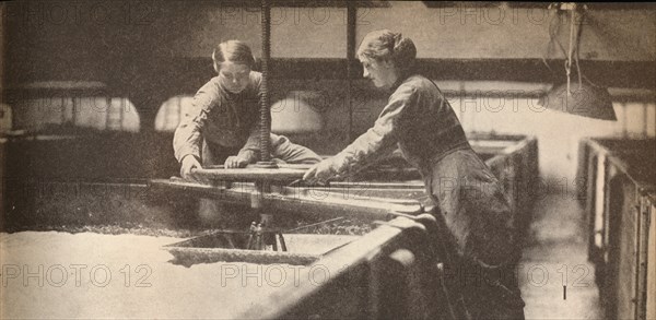 Screwing Down the Yeast in a Burton-On-Trent Brewery', c1916, (1935). Artist: Unknown.