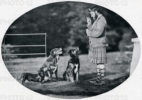 'Mr. Francis Clark, The Queen's Gillie, with three of her favourite dogs', c1899, (1901). Artist: GW Wilson and Company.
