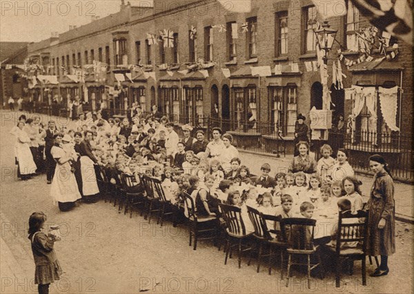 ' A children's tea party in an East End Street in London, to celebrate the Treaty of Versailles at t Artist: Unknown.